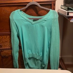 Blue green long sleeve shirt with holes